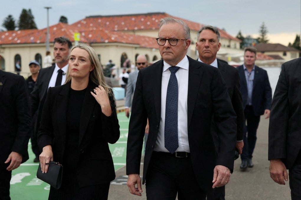 Australia’s Prime Minister Anthony Albanese and his wife are booed as they arrive at the Light Over Darkness vigil in Sydney, Australia on Sunday. Photo: Reuters