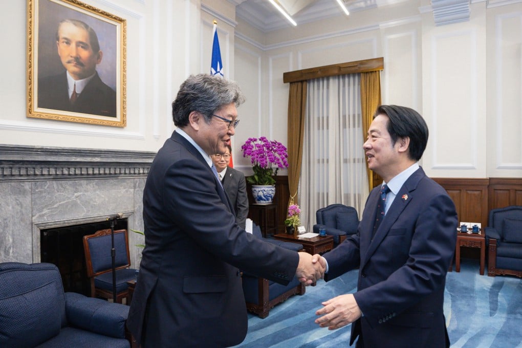 Japanese lawmaker Koichi Hagiuda (left) meets Taiwanese leader William Lai in Taipei on Monday. Photo: Handout