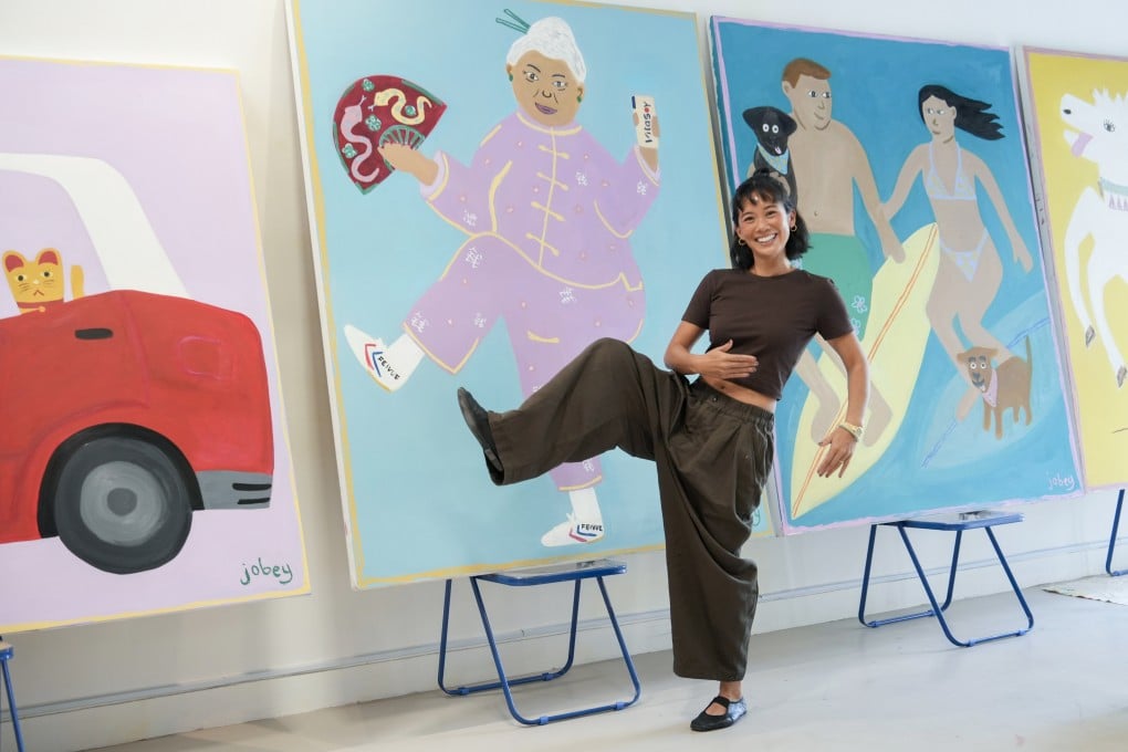 Hong Kong artist Joannah Hon poses with her paintings at her studio in Sai Ying Pun. Hon reveals her oversized oil paintings of local cultural icons on the streets of Hong Kong and her art has gone viral on Instagram. Photo: Sun Yeung