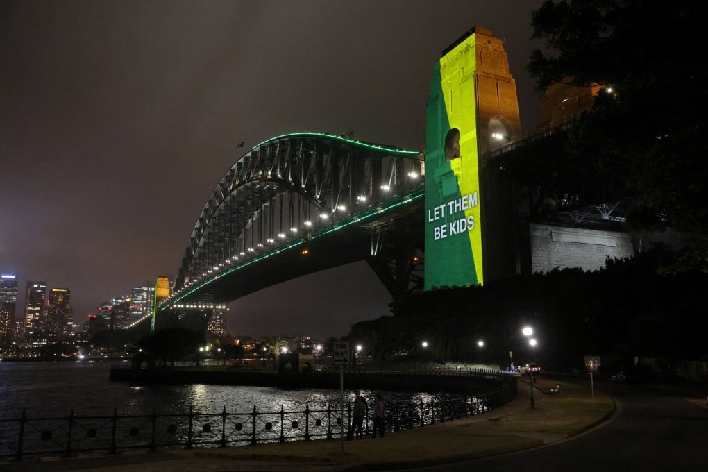A message that reads “Let them be kids” is projected onto the Sydney Harbour Bridge to mark a law banning social media for users under 16 in Australia on December 10. Photo: Reuters