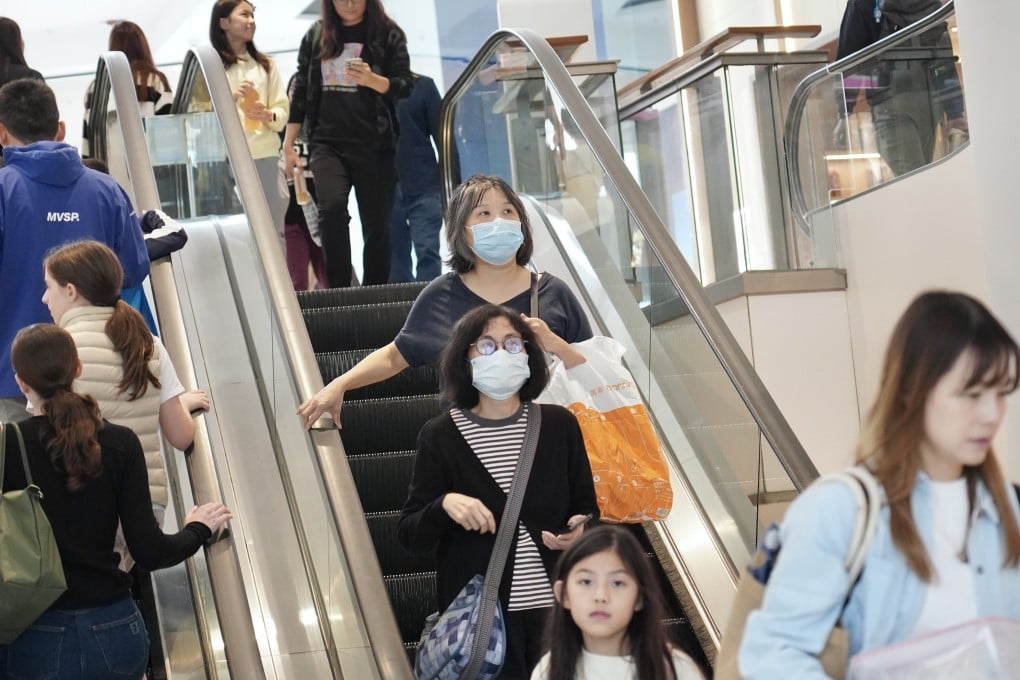Residents wear masks inside a shopping centre in Tai Kok Tsui. Photo: Karma Lo