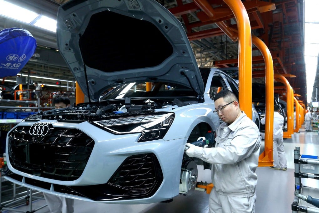 Factory workers assemble cars at a Volkswagen plant in Qingdao, in China’s eastern Shandong province, last week. Photo: AFP