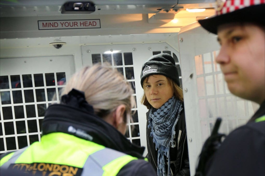 Greta Thunberg in a police van on Tuesday following her arrest in London at a demonstration. Photo: Prisoners for Palestine via AFP