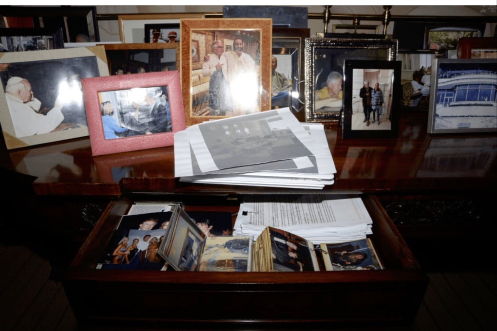 This photo released by the US Department of Justice shows a desk with a drawer open and photographs, documented in 2019, during a search of Jeffrey Epstein’s home in New York. Photo: US Department of Justice via AP