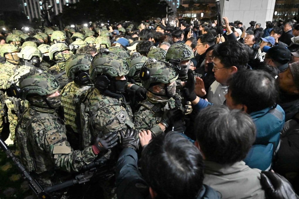 Soldiers try to enter the National Assembly building in Seoul, after then South Korea president Yoon Suk-yeol declared martial law on December 3, 2024. Photo: AFP
