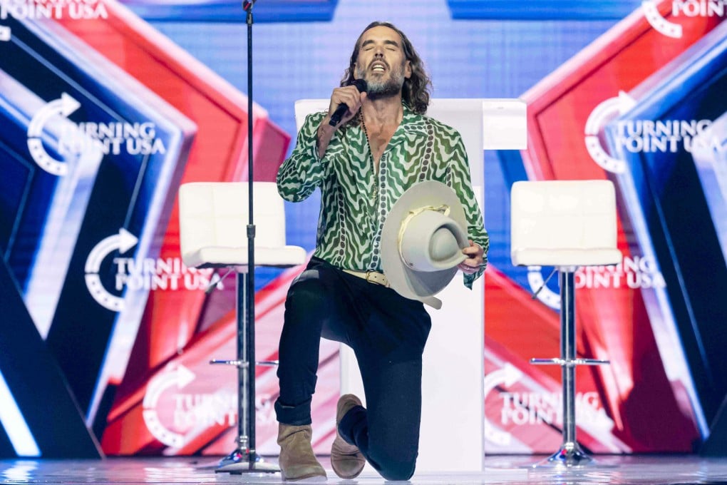 Russell Brand speaking at Turning Point USA’s AmericaFest 2025, on December 18 in Phoenix. Photo: AP