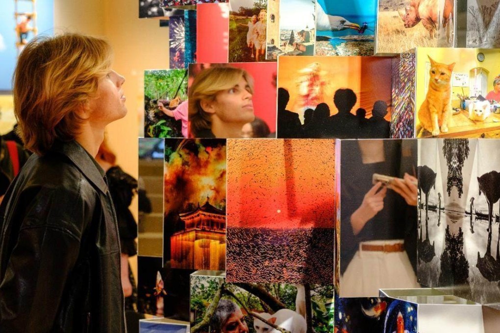 A visitor admires the images shortlisted in this year’s competition at last month’s Huawei Xmage Awards 2025 Ceremony and Exhibition, based on the theme “The World, You and Me”, in Paris.