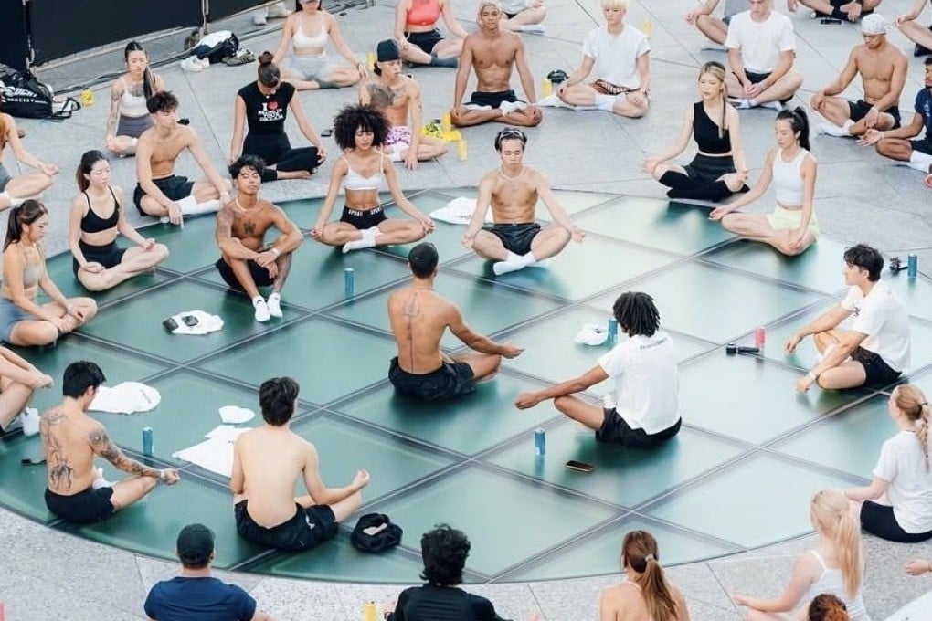 People take part in a yoga session at a recent SoberSweat event. Hong Kong’s young professionals are ditching traditional networking for wellness social clubs like this one. Photo: SoberSweat