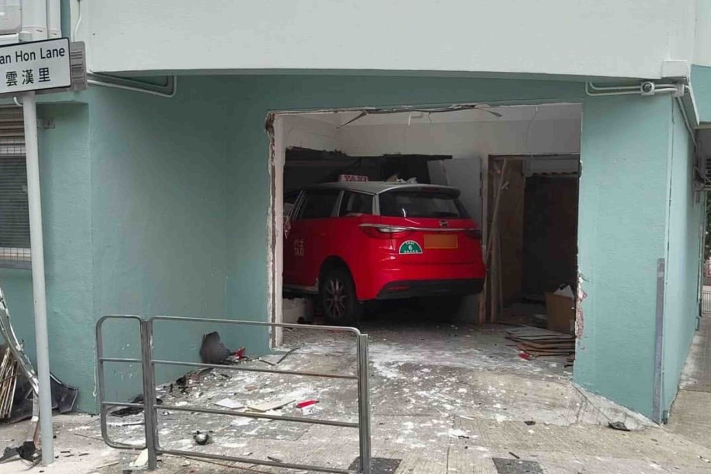 A taxi driver has been hospitalised after her vehicle crashed through the wall of a school building in Kwun Tong. Photo: Handout