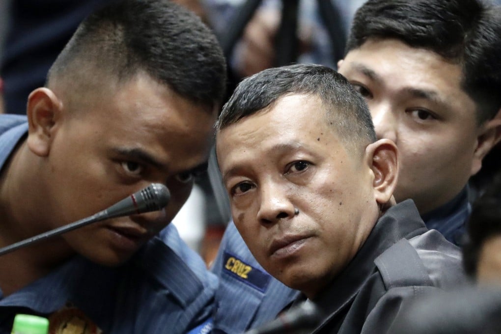 Filipino policemen (from left) Jeremiah Pereda, Arnel Oares and Jerwin Cruz attend a Senate inquiry in Pasay City on August 24, 2017. Photo: EPA