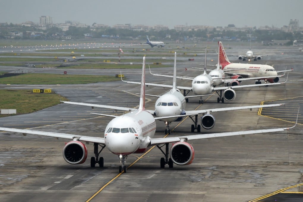 Aircrafts queue up on the tarmac before taking off at Mumbai airport. Photo: AFP