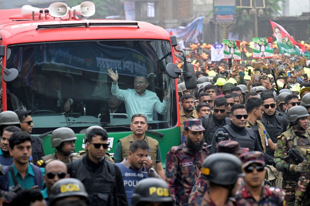 Bangladesh Nationalist Party (BNP) acting chairman Tarique Rahman waves to crowds from a vehicle after his arrival in Dhaka, Bangladesh, on Thursday. Photo: Reuters