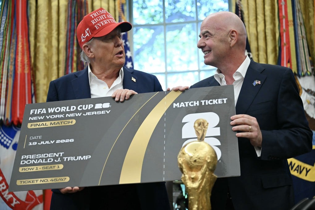 Fifa president Gianni Infantino, right, presents US President Donald Trump with a World Cup ticket for the final match, in the Oval Office of the White House in Washington on August 22. Photo: AFP