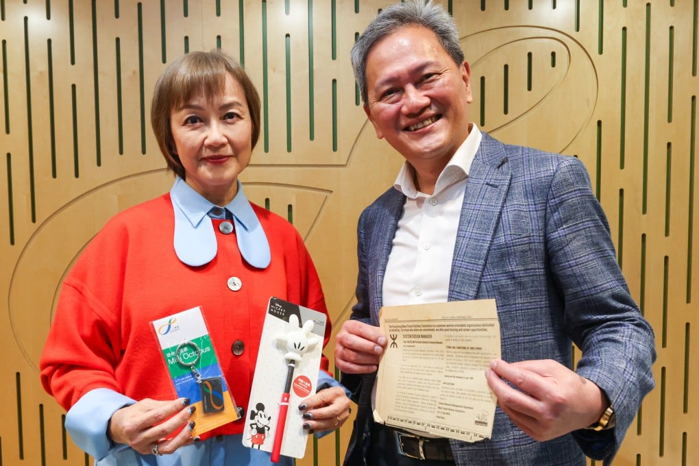 Rita Li, the sales and marketing director for Octopus, and chief operations officer Sammy Kam hold up items of memorabilia at their office in Kowloon Bay. Photo: Edmond So