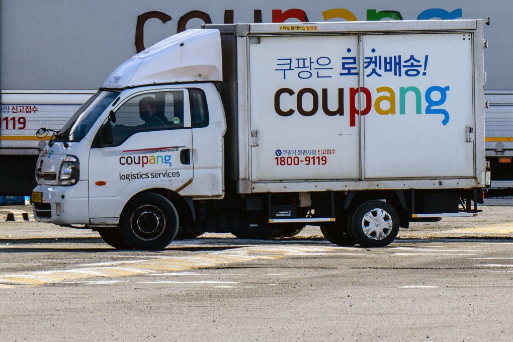 A worker drives a delivery truck of South Korean e-commerce giant Coupang in Seoul. Photo: AFP