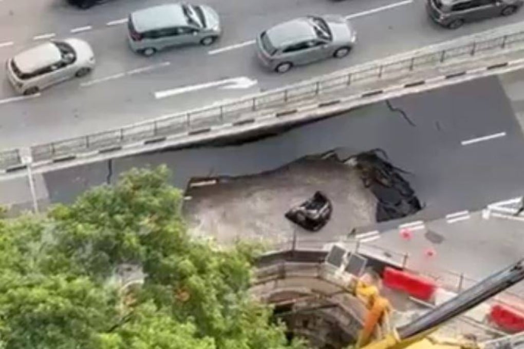 A still from a social media video shows a submerged car after it fell into a sinkhole in Singapore on July 26. Social media users hailed migrant workers for their quick response in saving the driver. Photo: X/HaggerDarren