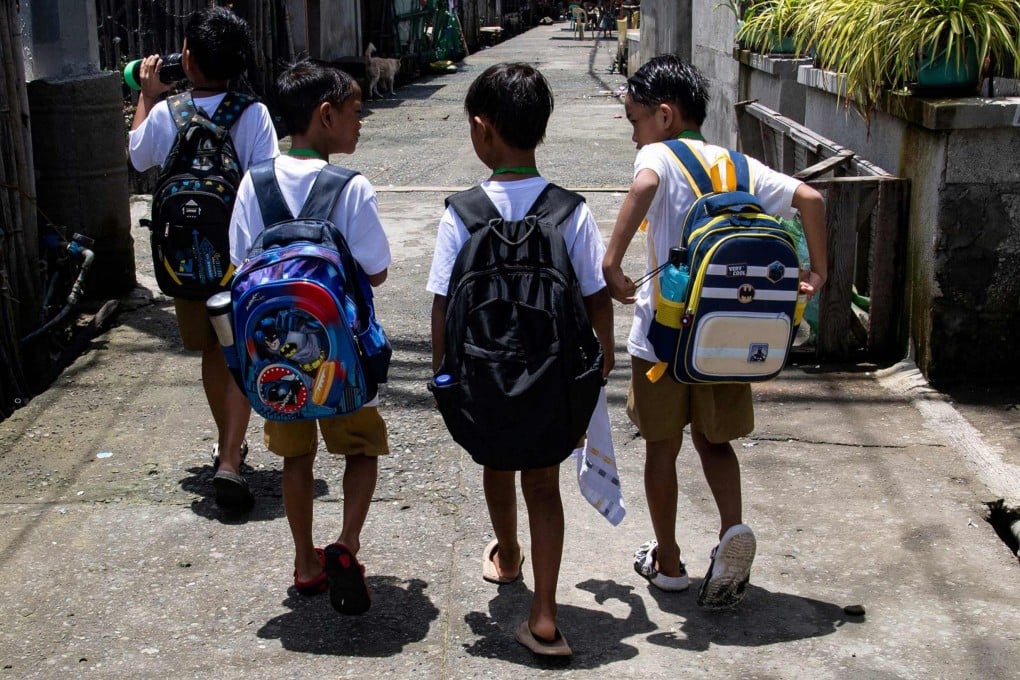 Filipino children walk to school on Isla Pugad in Hagonoy town, Bulacan province. Photo: AFP