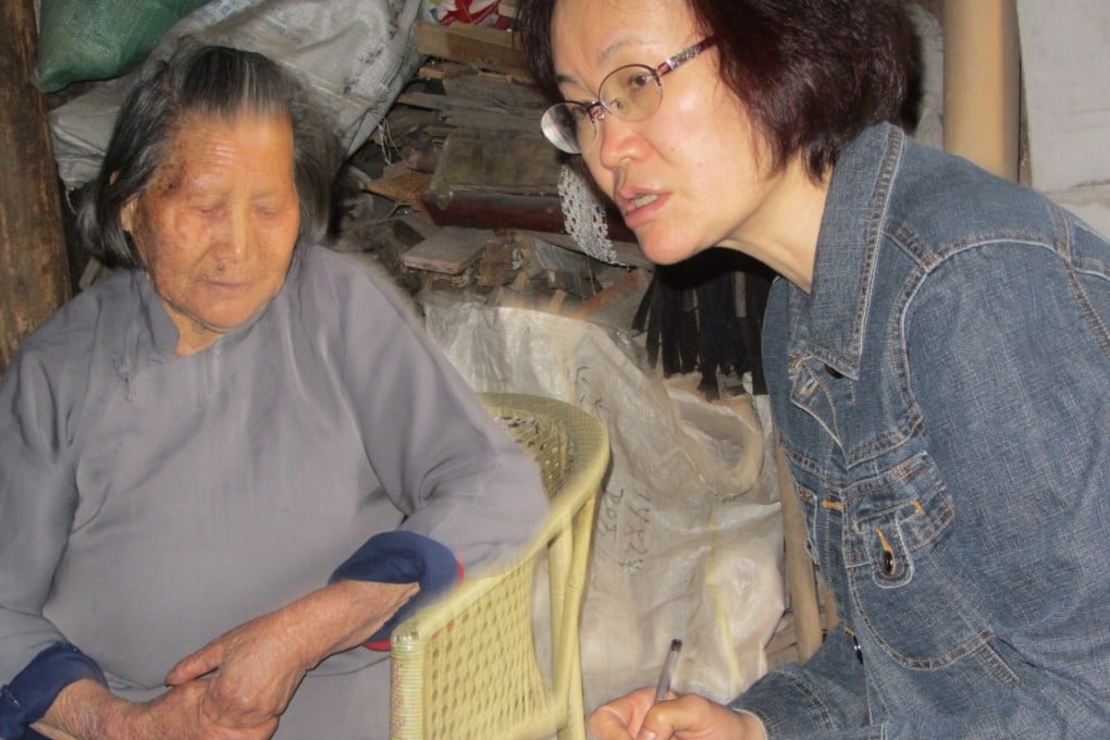 Chinese journalist Nan Xianghong interviews a resident of Chongshan village in Zhejiang province, who recounts witnessing Japanese soldiers performing vivisections on plague victims during World War II. Photo: Handout