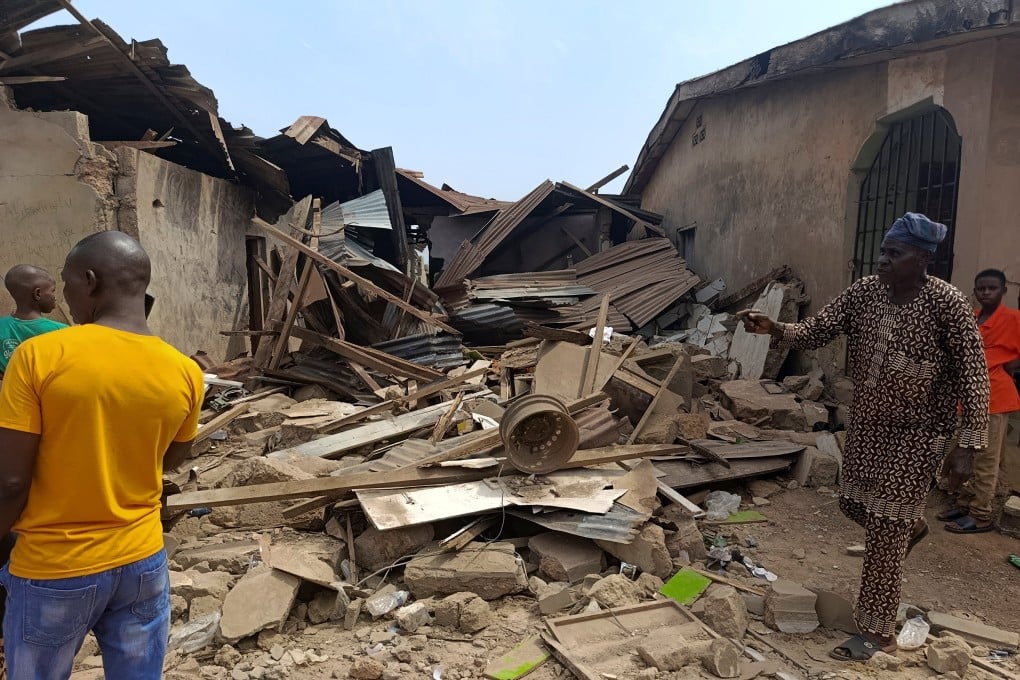 Residents inspect the damage the day after US forces launched a strike against Islamic State militants, in Offa, Kwara State, Nigeria on Friday. Photo: Reuters