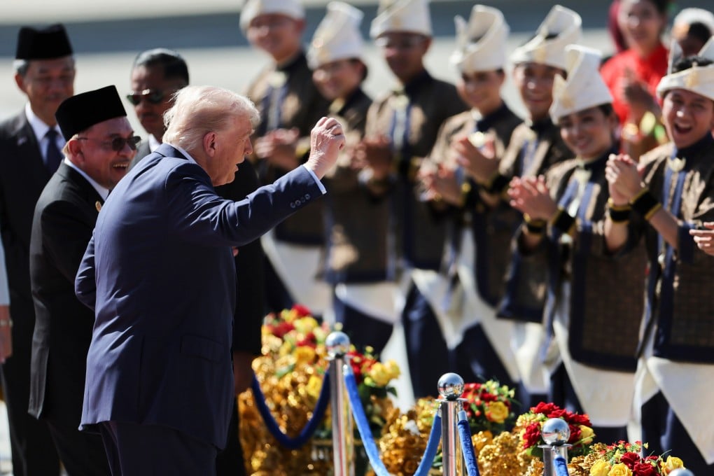 US President Donald Trump reacts to dancing performers at a welcoming ceremony after arriving at Kuala Lumpur International Airport to attend the Asean summit on October 26. Photo: AP