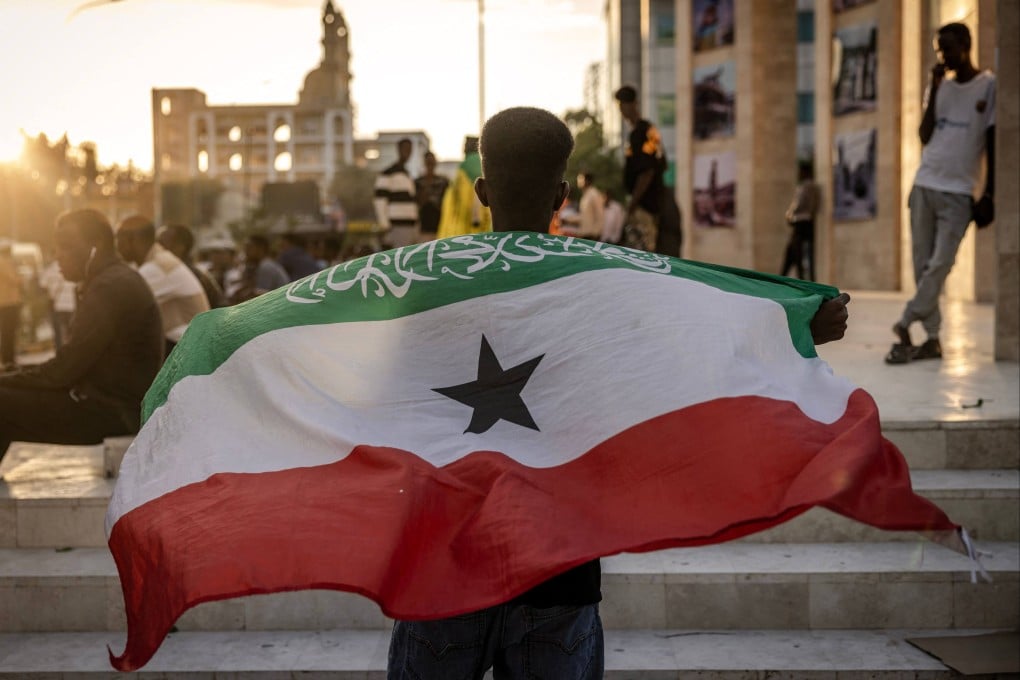 A man holds a flag of Somaliland in front of the Hargeisa War Memorial monument in Hargeisa. Somaliland’s president on Friday welcomed Israel’s announcement that it was recognising its statehood. Photo: AFP