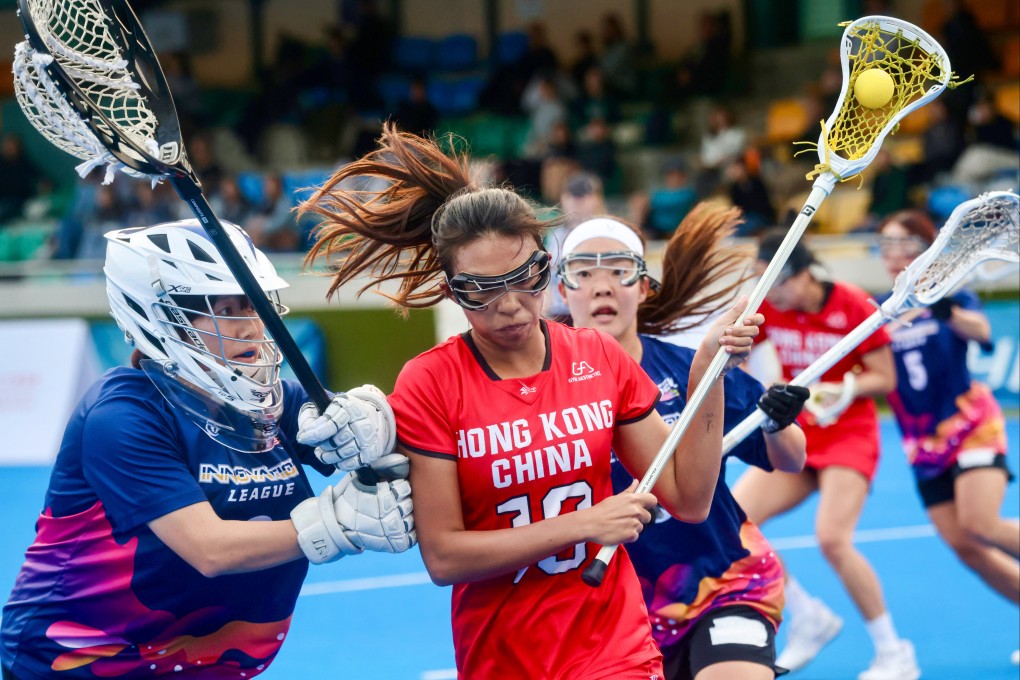Hong Kong’s Steffi Sze (right) battles to keep possession during her side’s Hong Kong International Lacrosse Sixes semi-final against Second Era Leaders of Lacrosse. Photo: Jonathan Wong