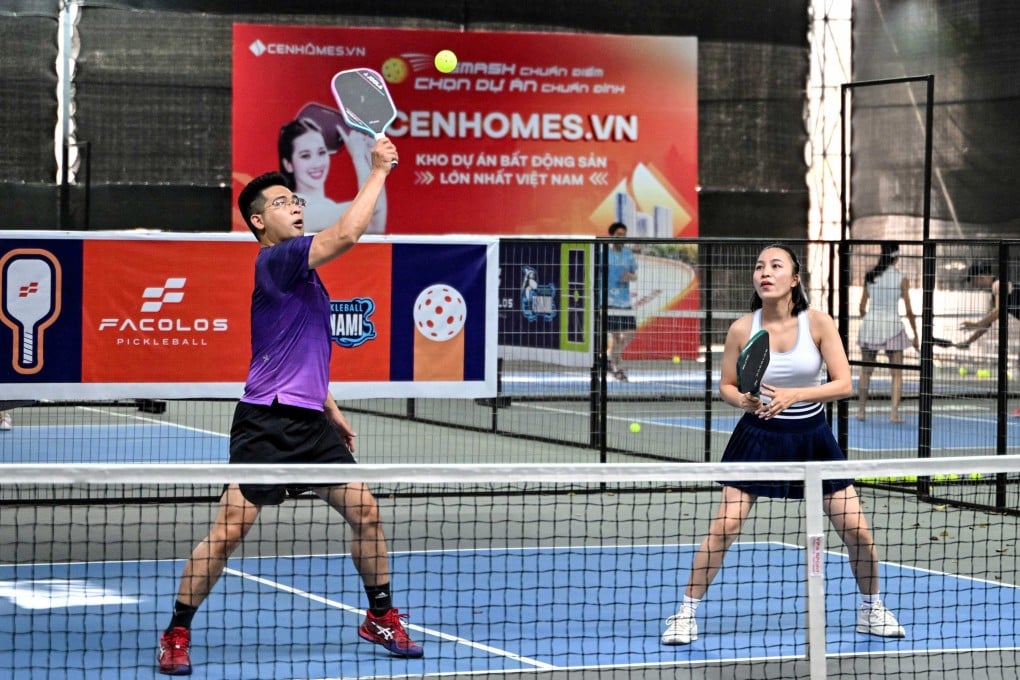 People play pickleball in the playground of a residential area in Hanoi, Vietnam. Photo: AFP