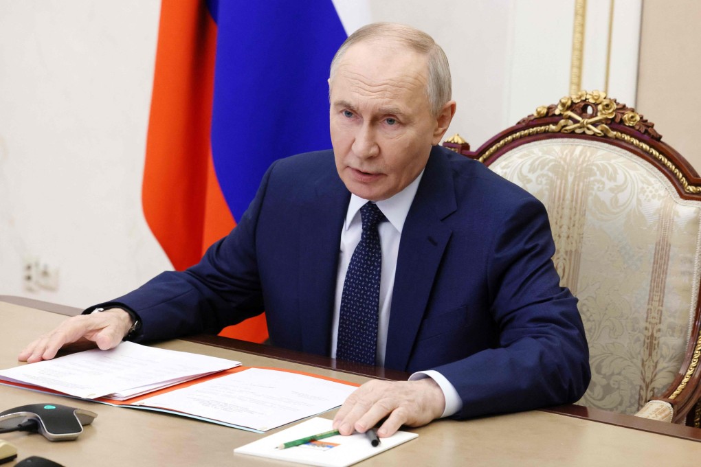 Russia’s President Vladimir Putin chairs a Security Council meeting via videolink in Moscow on December 26. Photo: Sputnik/AFP