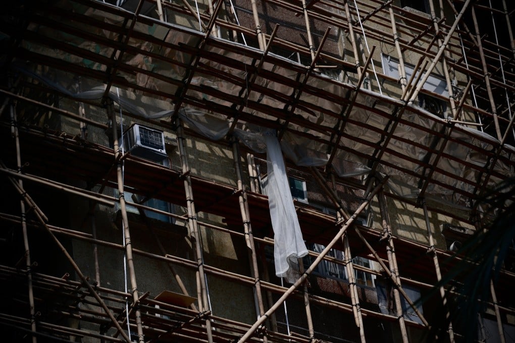 Bamboo scaffolding encases a building under repair in Hong Kong’s Sham Shui Po district on December 5. Hong Kong’s stock of ageing buildings presents a structural challenge. Photo: EPA