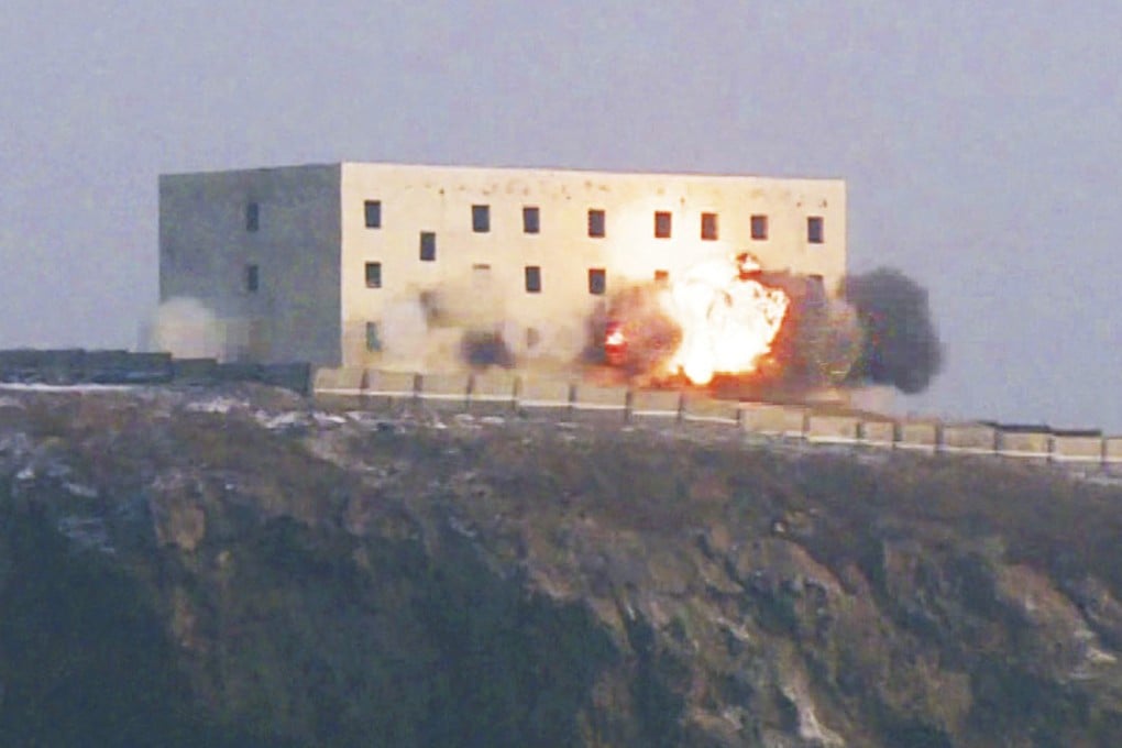 A North Korean long-range strategic cruise missile hitting its target on Sunday. Photo: KCNA via AFP