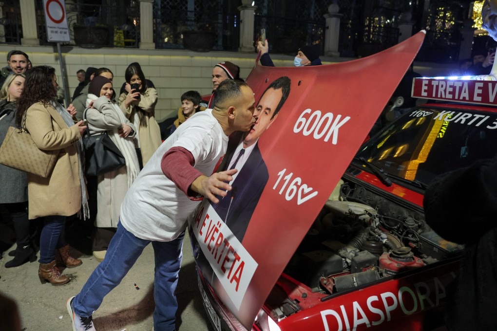A voter kisses a poster with an image of Kosovo’s Prime Minister Albin Kurti on Sunday. Photo: Reuters
