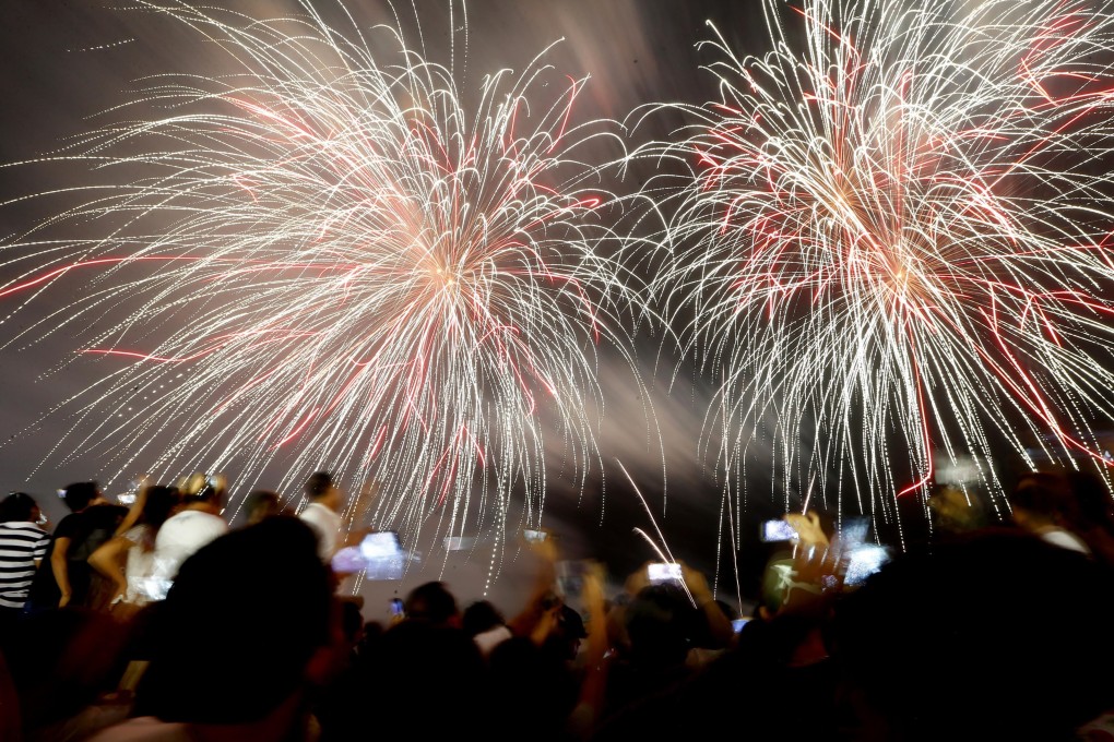 Filipino revellers in Manila watch as fireworks light up the sky to welcome the new year. Fireworks remain deeply woven into the Philippines’ new year traditions. Photo: AP