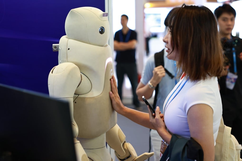A visitor interacts with a robot at the Pujiang Innovation Forum in  Shanghai on September 21. Photo: Xinhua