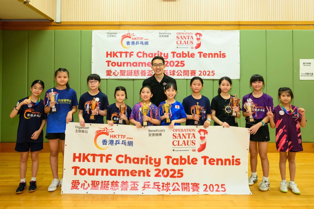 Winners of the Open U11 girls’ category receive their awards from HKTTF founder Ray Chan Shu-yan. Photo: Handout
