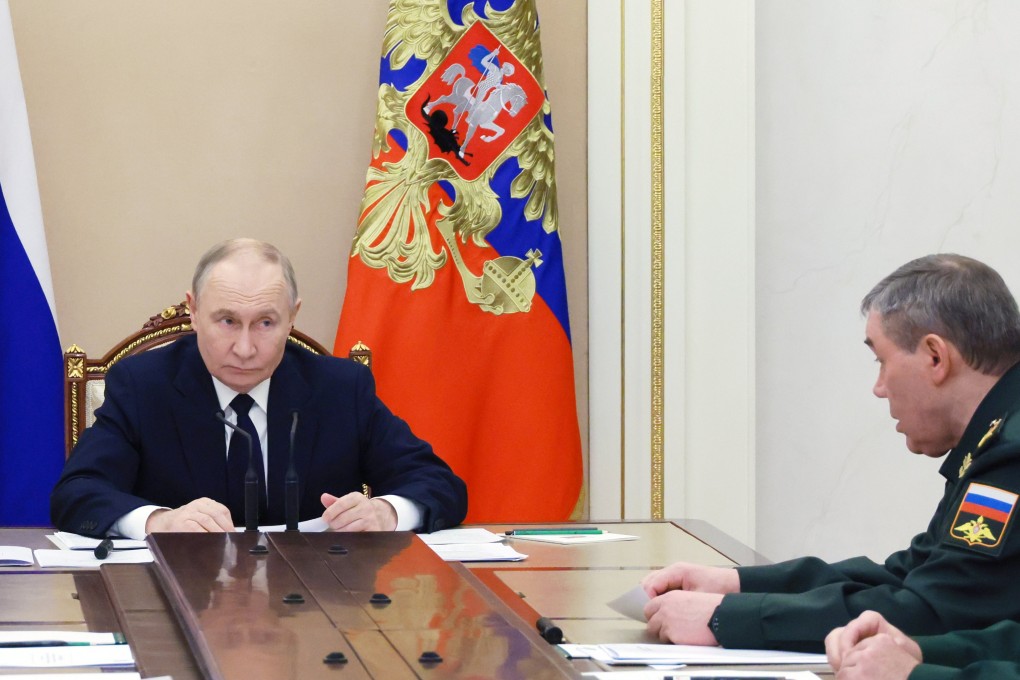 Russian President Vladimir Putin, left, chairs a meeting at the Kremlin in Moscow on Monday as Valery Gerasimov, Chief of the General Staff of the Russian Armed Forces, sits nearby. Photo: Mikhail Metzel / Sputnik / Kremlin Pool / EPA