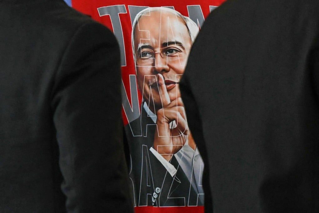 A supporter’s T-shirt bears an image of Najib Razak during his 1MDB trial in Putrajaya, Malaysia, on Friday. Photo: AFP