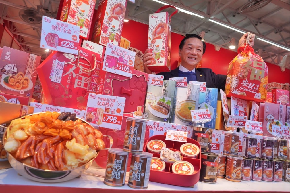 Richard Poon Kuen-fai of On Kee Dry Seafood poses at the 59th Brands and Products Expo, held at Victoria Park in Hong Kong. The expo is a local tradition offering discounted pantry staples and affordable luxury foods like canned abalone. Photo: Elson Li