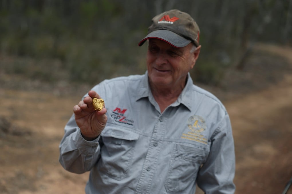 Tony Mills from The Gold Centre holds a gold nugget he found earlier this year in Maryborough, Australia. Photo: Reuters