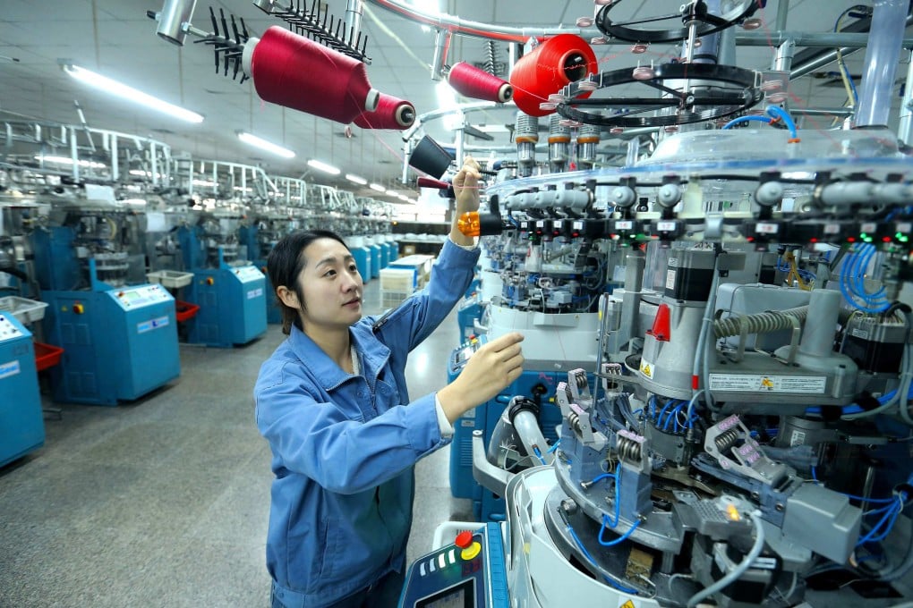 A major indicator of China’s factory activity returned to expansion in December, after eight straight months of contraction. Photo: AFP