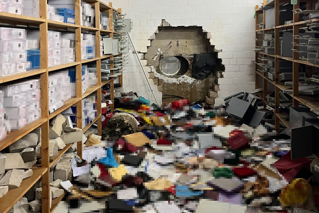 A giant hole in a wall of the vault of a Sparkasse bank branch after thieves broke in at the weekend. Photo: Police Gelsenkirchen handout via AFP