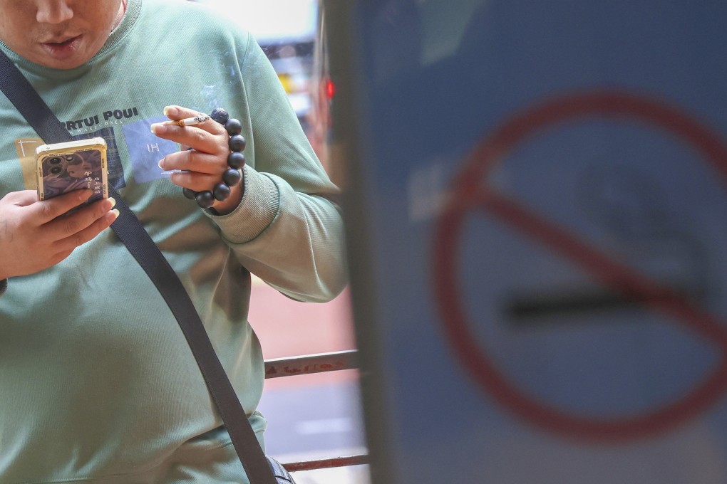 A resident smokes along Canton Road in Tsim Sha Tsui. Photo: Jelly Tse