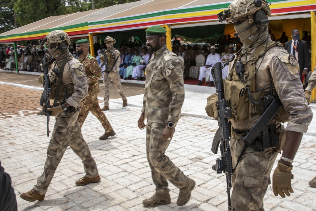 The leader of Mali’s ruling junta, Assimi Goita, centre, attends an independence day military parade. File photo: AP