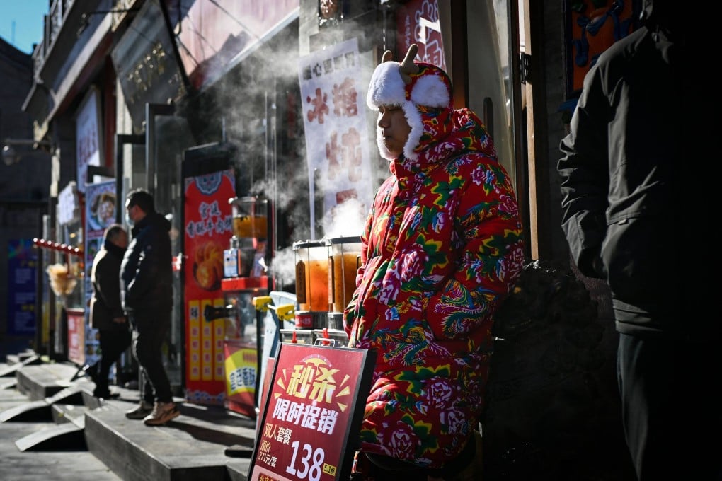 A costumed man promotes restaurant specials in Beijing on December 2, 2025. Photo: AFP