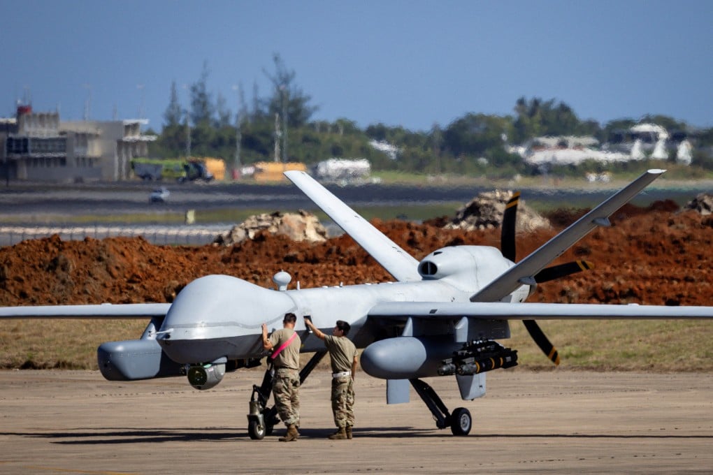 Personnel work on a US Air Force MQ-9 Reaper drone at Rafael Hernandez Airport in Puerto Rico. Photo: Reuters