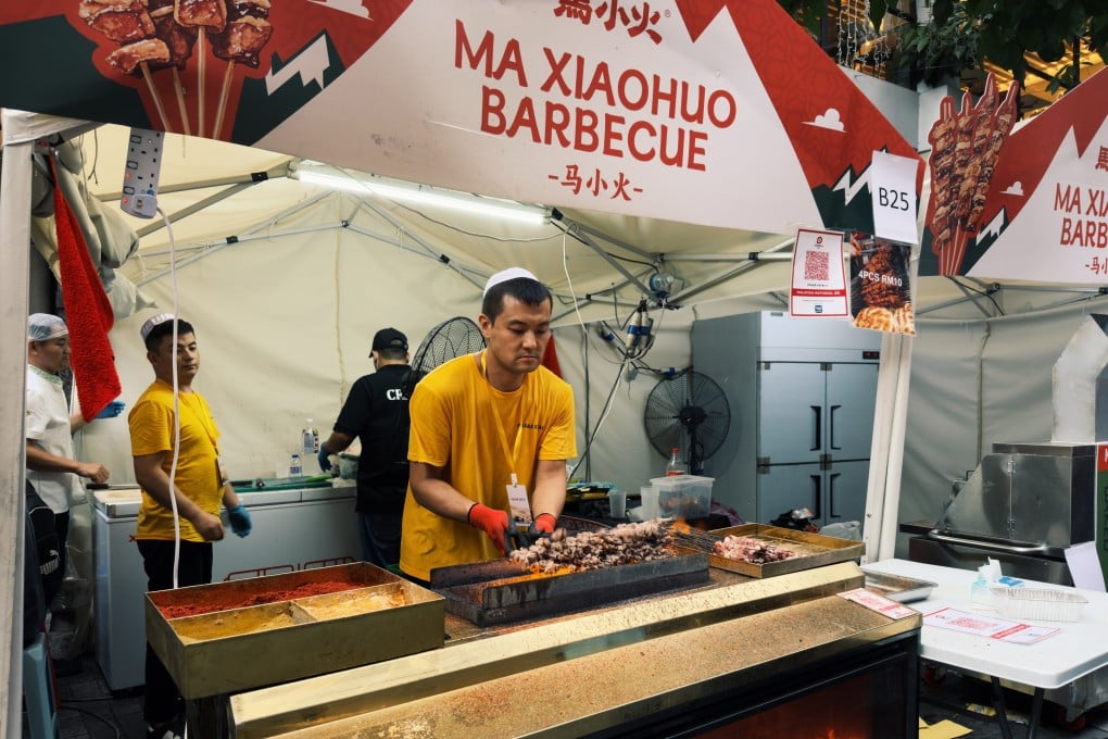 A vendor grills skewered meats at the Pasar Eatai Chinese Muslim Festival at 1 Utama Shopping Centre in Kuala Lumpur on Tuesday. Photo: Iman Muttaqin Yusof