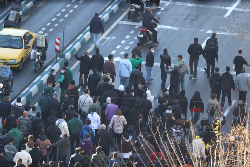 Shopkeepers and traders protest in the street against the economic conditions and Iran’s embattled currency in Tehran on Monday. Photo: AFP