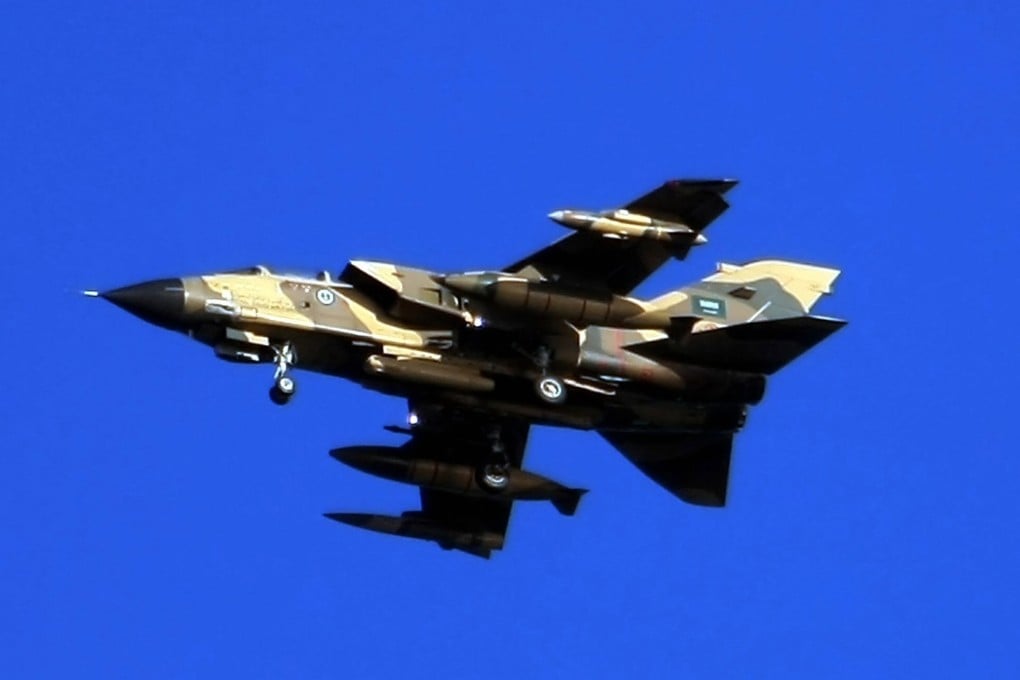 A Saudi tornado warplane flies over the Gulf Sea during a training mission in 2007. Photo: AFP
