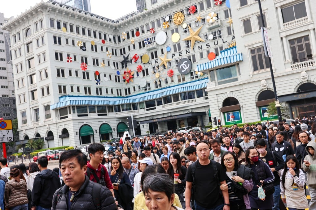 Tourists outside the Peninsula in Tsim Sha Tsui on New Year’s Day. Photo: Jelly Tse