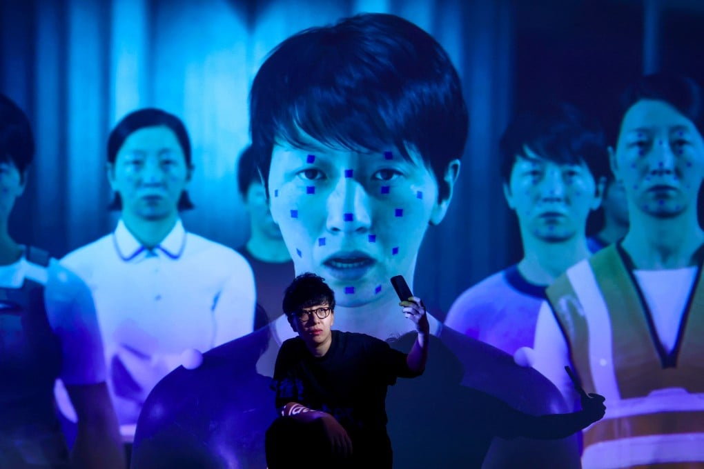 Artist Lau Wai is pictured in front of W.A.I – The Cast of the Invisible, a short film by the artist that is being screened as part of a new exhibition at the Hong Kong Design Institute. Photo: Jonathan Wong