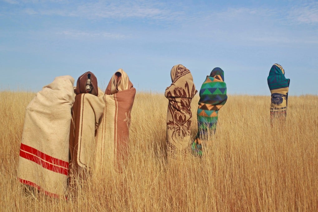 Boys stand in a field during traditional Xhosa male circumcision ceremonies into manhood in Qunu, South Africa, in June 2013. Photo: AP